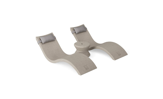 The Ledge Lounger Signature Chaise Headrest Pillow and Side Table In-Pool Set features two beige modern chaise loungers with gray headrests, joined by a round table, offering the ideal poolside seating against a white background.