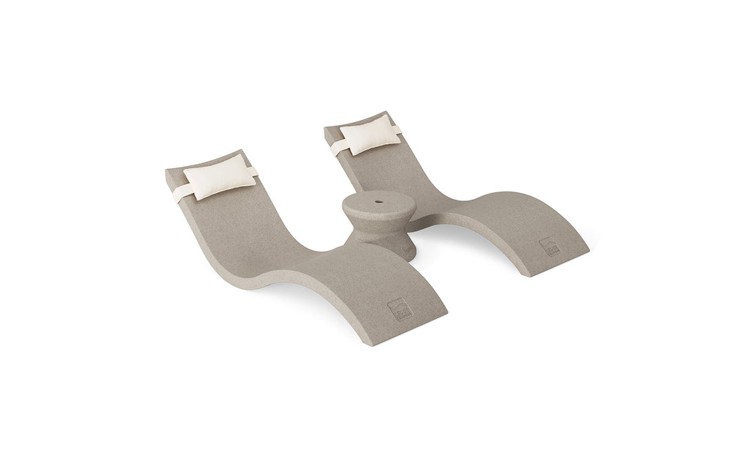 The Ledge Lounger Signature Chaise Headrest Pillow and Side Table In-Pool Set features two modern beige reclining seats with white headrest pillows and a central table—ideal for relaxing poolside. Shown on a plain white background.