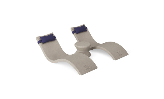 The Ledge Lounger Signature Chaise Headrest Pillow and Side Table In-Pool Set features two beige curved lounges with blue headrests and a round center table, creating a stylish, relaxing poolside retreat. Perfect for your outdoor paradise.