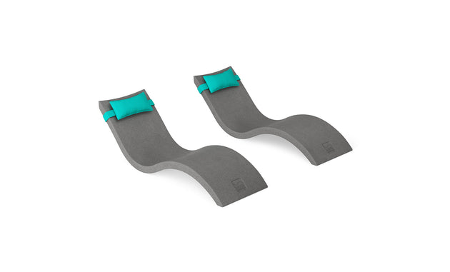 The Ledge Lounger Signature Chaise and Headrest Pillow In-Pool Set features two modern, curved gray loungers with teal pillows, side by side on a white background—ideal for creating a perfect outdoor escape.
