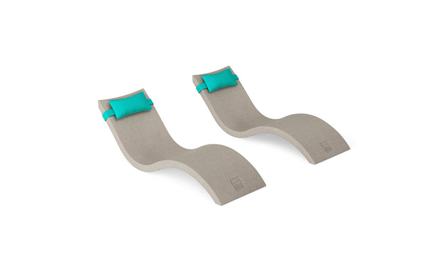 The Ledge Lounger Signature Chaise and Headrest Pillow In-Pool Set features two modern gray chaise lounges with turquoise headrest pillows, side by side on a white background—ideal for your outdoor retreat.