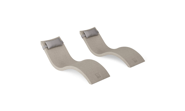 The Ledge Lounger Signature Chaise and Headrest Pillow In-Pool Set features two modern beige S-shaped loungers with gray headrests, placed side by side on a white background for the ideal outdoor escape.