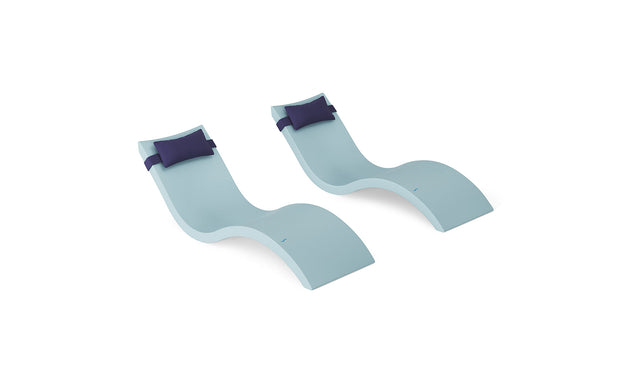 The Ledge Lounger Signature Chaise and Headrest Pillow In-Pool Set features two modern light blue chaise lounge chairs with dark blue headrest pillows, side by side on a white background—ideal for your outdoor oasis.