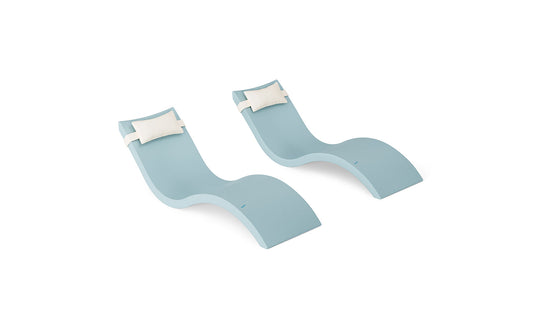 The Ledge Lounger Signature Chaise and Headrest Pillow In-Pool Set features two sleek, light blue lounge chairs with white pillows, placed side by side on a white backdrop—ideal for your outdoor relaxation.