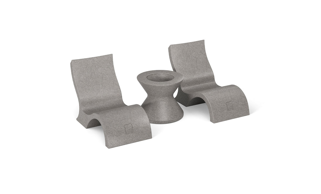 Two gray, curved Relaxation In-Pool Chairs by Ledge Lounger with ergonomic design flank a cylindrical table with a concave center. This modern, minimalist set features smooth surfaces, perfect as poolside essentials for your outdoor or patio space.