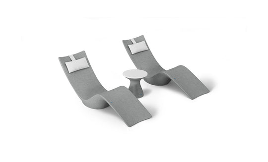 The Ledge Lounger Resort Luxury Outdoor Paradise In-Pool Furniture Bundle includes two modern gray lounge chairs with white cushions flanking a small round white side table. Arranged against a white background, these pieces offer a sleek, minimalist aesthetic perfect for poolside relaxation.