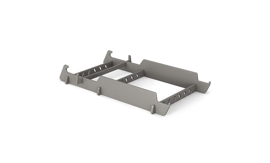 A gray metal server rack mount bracket with angled edges is designed to hold equipment securely, similar to the precision of a Signature Lowback Chair Riser by Ledge Lounger. It features multiple cutouts and slots for adjustable fitting, all set against a white background.