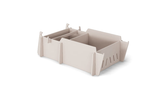 The Signature Lowback Chair Riser by Ledge Lounger offers modular compartments and side slots for efficient storage. Its minimalist, stackable design is perfect for elevated organization, seamlessly blending with any decor.