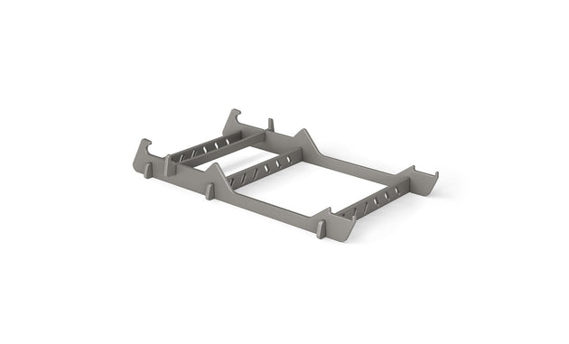 The Signature Chair Riser by Ledge Lounger is a gray, rectangular plastic rack with multiple slots and cut-out handles—ideal for in-pool seating or organizing essentials outdoors.