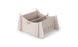 The Ledge Lounger Signature Chaise Riser is a beige modular storage box with interlocking panels, ideal for outdoor essentials. Vertical slots and a central divider create two compartments perfect for organizing in-pool seats or other items.