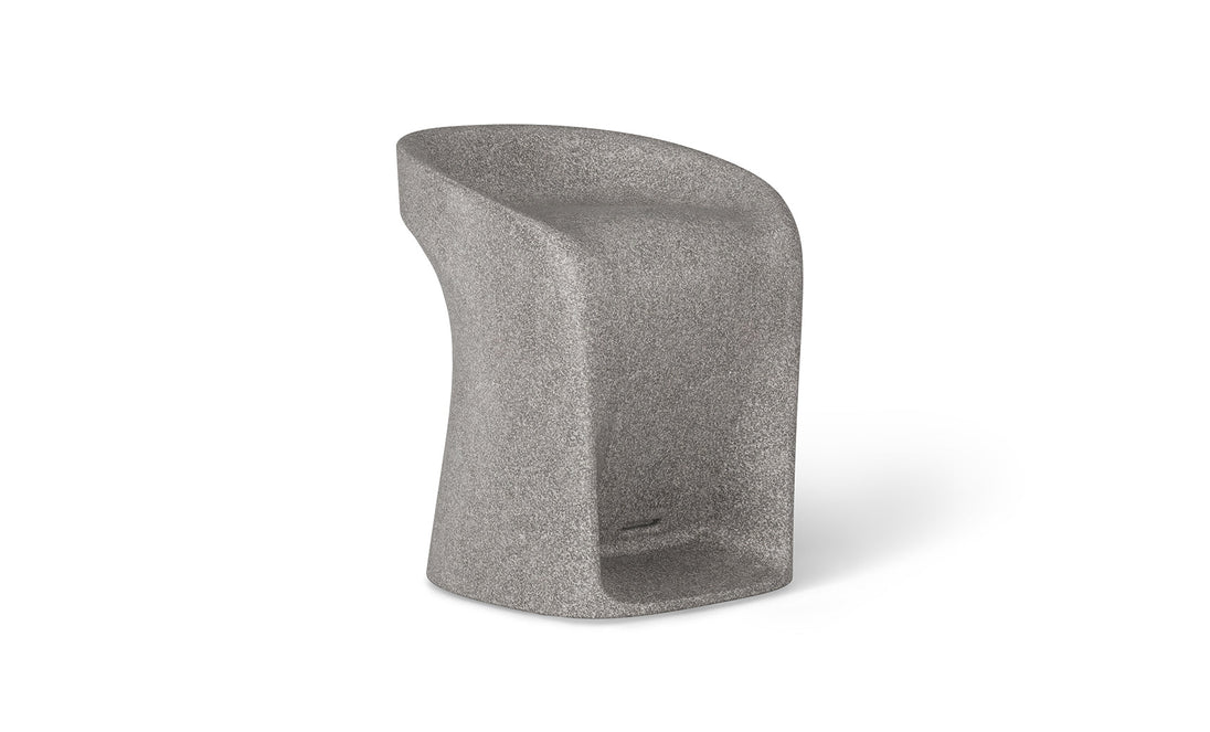 The Ledge Lounger Signature Barstool Counter Height is a modern gray concrete chair with a smooth, curved design. It features a high backrest transitioning into a narrow, slightly twisted base with textured surface, perfect for a contemporary industrial look.