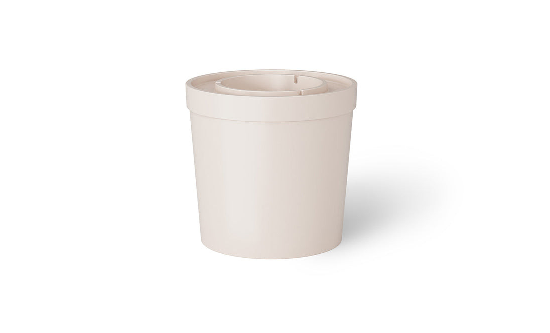 The Signature Ice Basin by Ledge Lounger is a white, cylindrical plastic container resembling an umbrella base with a wide open top and recessed inner ring. It sits against a plain white background, casting a subtle shadow to the right for added depth.