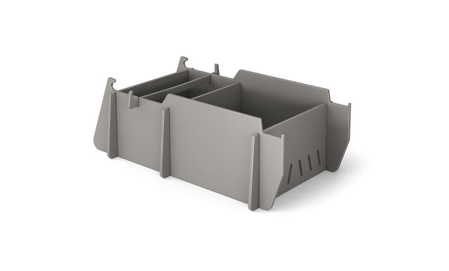 The Signature Lowback Chair Riser by Ledge Lounger is a gray modular storage solution with customizable interlocking compartments and slots, perfect for organizing and elevating your outdoor essentials against a white background.
