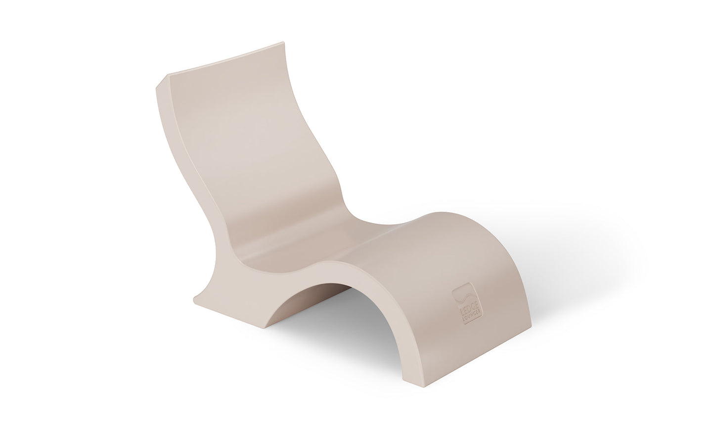 The Signature Lowback Chair by Ledge Lounger is a modern, minimalist beige lounge chair with flowing curves, perfect for poolside. It features a wavy design and no armrests. A subtle logo is embossed near the base and its made of solid material, ideal for creating an outdoor oasis of style and comfort.