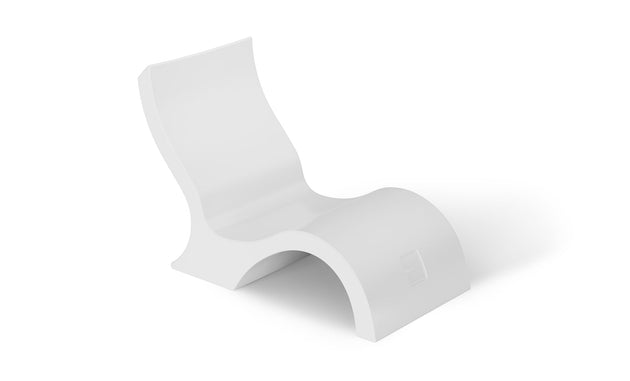 The Ledge Lounger Signature Lowback Chair, with its sleek, curved wave-like design and high backrest, provides ideal poolside seating. Its modern white finish creates an inviting outdoor oasis on any plain background.