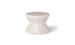 The Signature Standard Side Table by Ledge Lounger is a small, hourglass-shaped, light beige stool with a smooth surface for in-pool use on sun shelves. It features the word EDGE inscribed near the bottom, adding elegance and functionality.