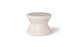 The Signature Standard Side Table by Ledge Lounger is a small, hourglass-shaped, light beige stool with a smooth surface for in-pool use on sun shelves. It features the word EDGE inscribed near the bottom, adding elegance and functionality.