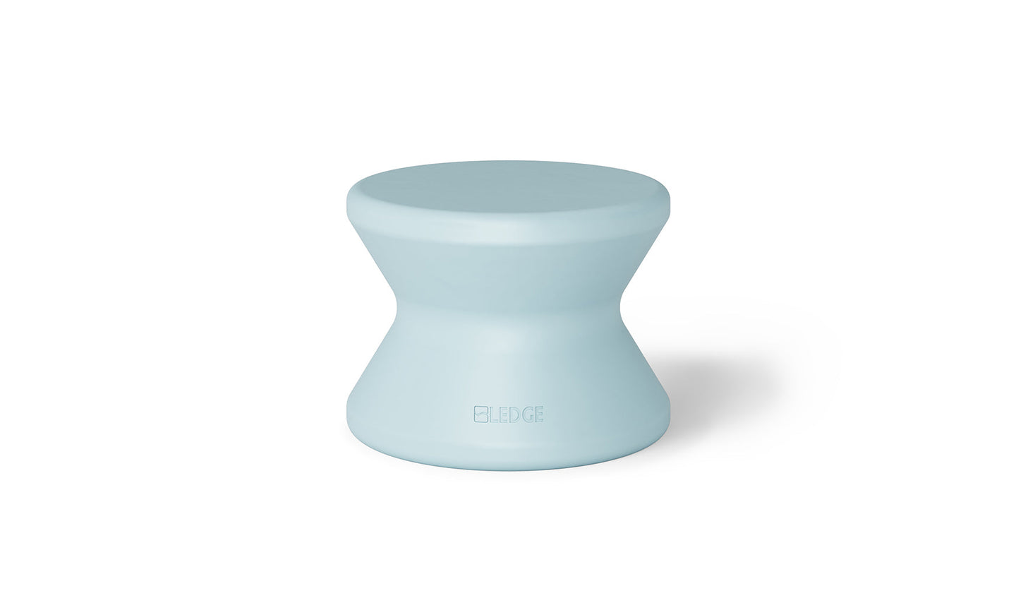 The BLEEGE light blue hourglass stool, with a wider top and bottom, offers sun shelf comfort. Its sleek surface makes it ideal for in-pool use, seamlessly blending style and functionality reminiscent of a Ledge Lounger Signature Standard Side Table.