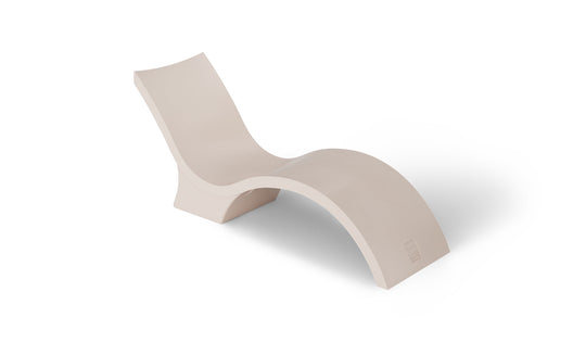 The Ledge Lounger Signature Chaise Deep is a modern cream-colored, S-shaped lounge designed for pool tanning ledges, perfect for relaxation on a white backdrop.