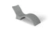 The Signature Chaise Deep by Ledge Lounger is a minimalist grey lounge chair with a wavy, modern design like a chaise lounge, featuring smooth surfaces and continuous curves for a sleek look. Its shown against a plain white background.