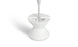 The Signature Tall Ice Bin Side Table by Ledge Lounger has a sleek, modern white design resembling an umbrella base. Its minimalist look features a smooth finish, while its hourglass shape adds elegance against a plain white background.