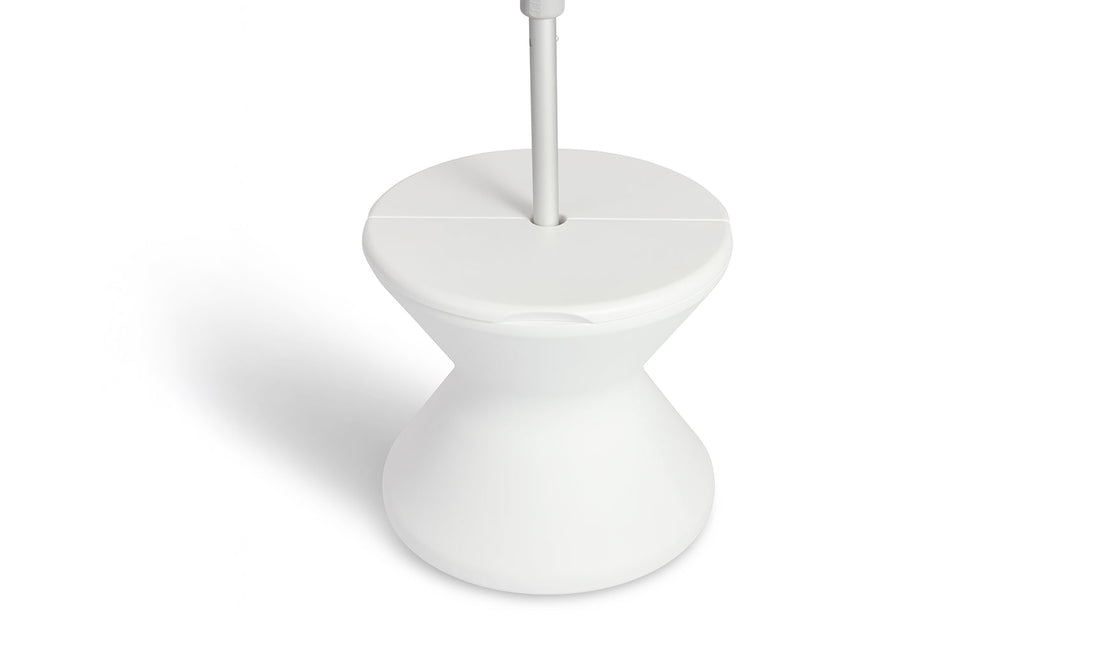 The Signature Tall Ice Bin Side Table by Ledge Lounger is a modern, white, hourglass-shaped stand with a flat top and sleek design. Its minimalistic style features smooth curves and a clean finish, making it both functional and stylish.