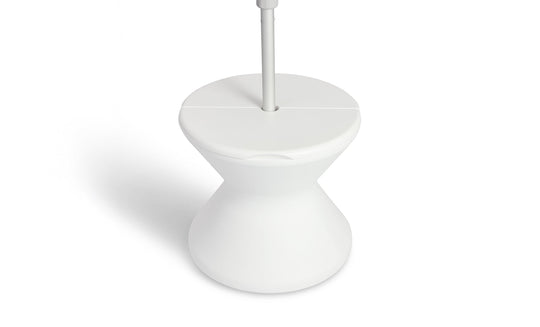 The Signature Tall Ice Bin Side Table by Ledge Lounger is a modern, white, hourglass-shaped stand with a flat top and sleek design. Its minimalistic style features smooth curves and a clean finish, making it both functional and stylish.