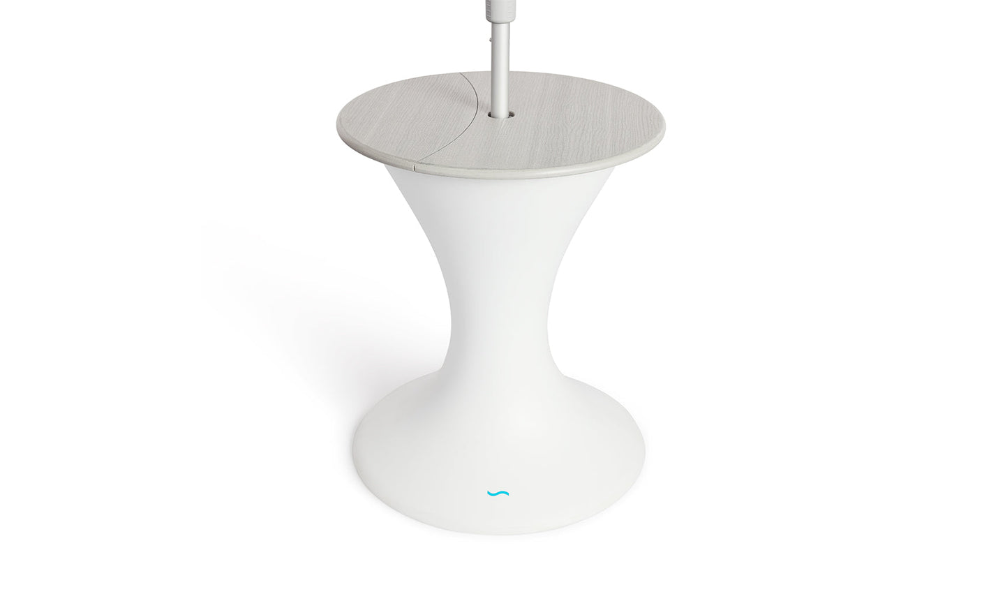 The Autograph Umbrella Stand Ice Bin by Ledge Lounger features a sleek design with a modern white pedestal base, a round gray top, and a central pole resembling an outdoor table. The flared base mimics an umbrella stand and showcases the small blue logo near the bottom.