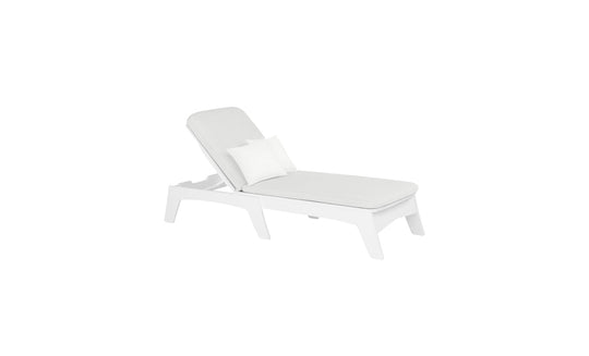 The Mainstay Chaise Cushion by Ledge Lounger features a reclining backrest and customizable cushion in white. Its minimalist design with sleek lines offers full-body comfort, perfect for relaxation in garden or poolside settings against a plain white background.