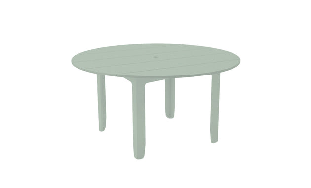 The Mainstay Round Dining Table by Ledge Lounger is a light green, round patio table with a slatted surface and four legs. Its perfect for outdoor dining and includes a convenient built-in umbrella sleeve.