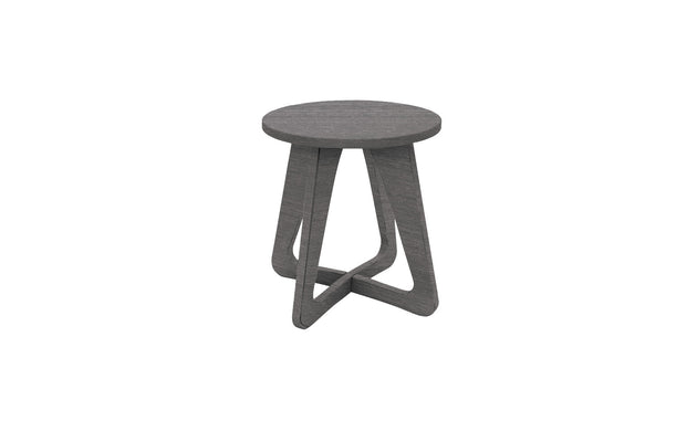 Introducing the Mainstay Stool by Ledge Lounger: a sleek grey wooden stool with a round seat and modern geometric base featuring triangular leg designs. Ideal for patios, it seamlessly enhances any outdoor space with its contemporary style.