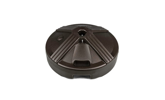 The Ledge Lounger Resin Coated Concrete Umbrella Base boasts a black, circular, textured surface and is perfect for center pole umbrellas. It secures the umbrella with a central hole, enhancing any outdoor dining setup.