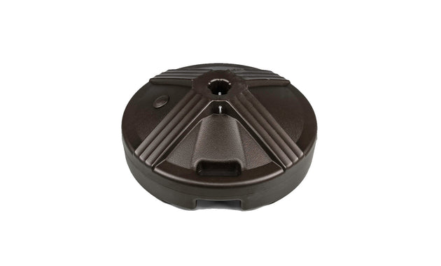 The Ledge Lounger Resin Coated Concrete Umbrella Base boasts a black, circular, textured surface and is perfect for center pole umbrellas. It secures the umbrella with a central hole, enhancing any outdoor dining setup.