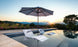 Ledge Lounger in-pool umbrella and chaises.