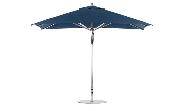 A freestanding Ledge Lounger Premier Aluminum Umbrella, 8.5 rectangle with a pulley, features a sleek metal pole, circular base, and marine-grade dark blue fabric for durability, set against a plain white background.