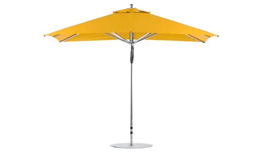 The Ledge Lounger Premier Aluminum Umbrella - 8.5 Rectangle Pulley features a wind-resistant, vibrant yellow canopy made from marine-grade fabrics with a sturdy metal pole and circular base, offering modern, durable shade for any patio or garden setting.