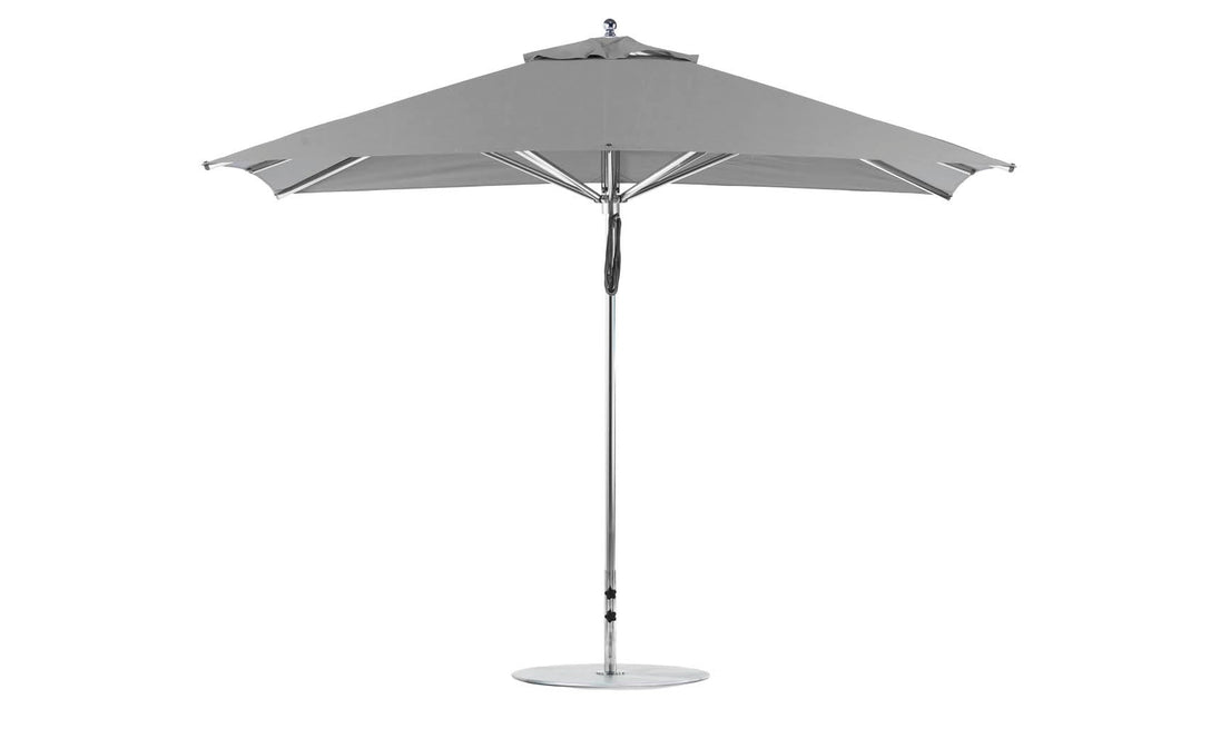 The Ledge Lounger Premier Aluminum Umbrella boasts an 8.5 rectangular canopy with a slim metal pole and round base, featuring marine-grade fabrics for durability and a minimalist design.