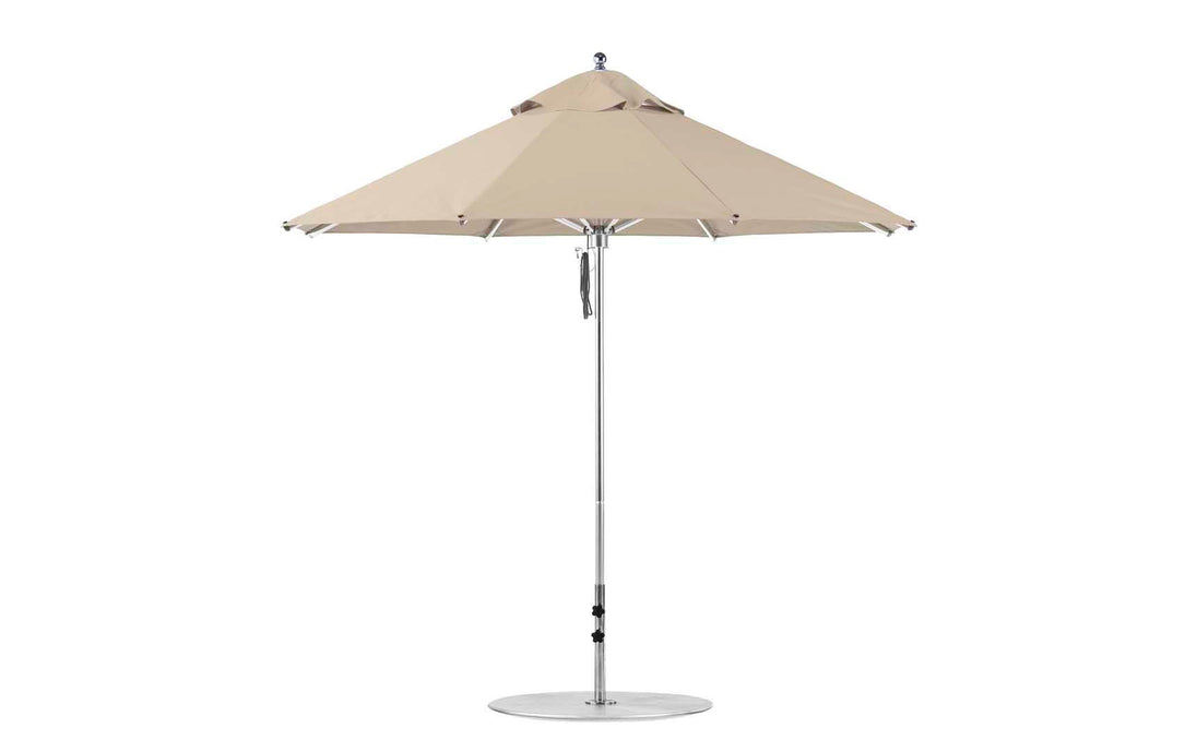 The Premier Aluminum Umbrella - 9 Octagon Pulley by Ledge Lounger features a beige marine-grade fabric canopy, a silver pole, and circular base against a plain white background.