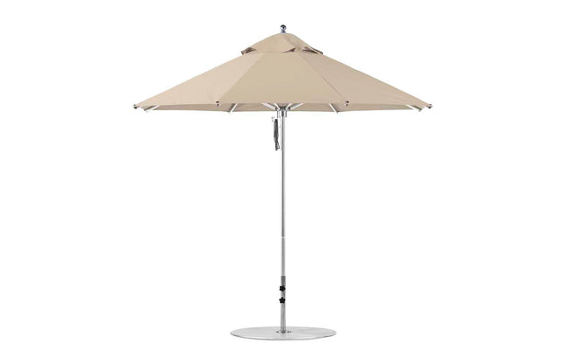 The Premier Aluminum Umbrella - 9 Octagon Pulley by Ledge Lounger features a beige marine-grade fabric canopy, a silver pole, and circular base against a plain white background.