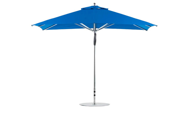 The Ledge Lounger Premier Aluminum Umbrella - 8.5 Rectangle Pulley features a wind-resistant, wide canopy in marine-grade fabric. It stands fully open with a sturdy metal pole and base in all its blue glory against a plain white background.