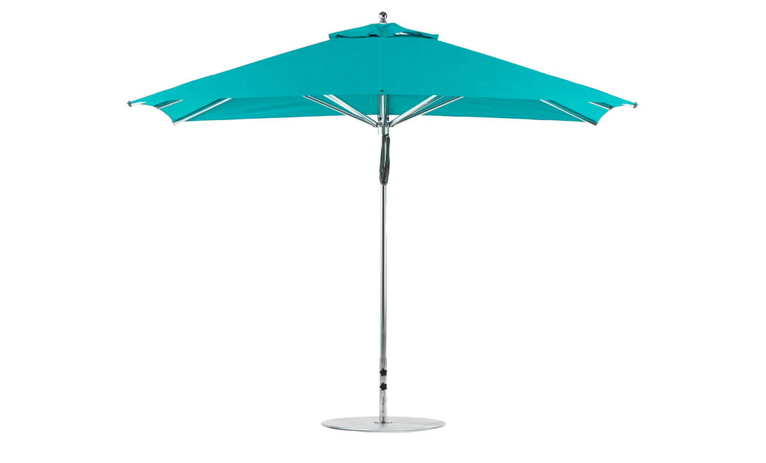The Ledge Lounger Premier Aluminum Umbrella - 8.5 Rectangle Pulley in turquoise boasts a wind-resistant design with a silver pole and round base, fully open to display its wide canopy, metallic frame, and marine-grade fabrics for lasting style.