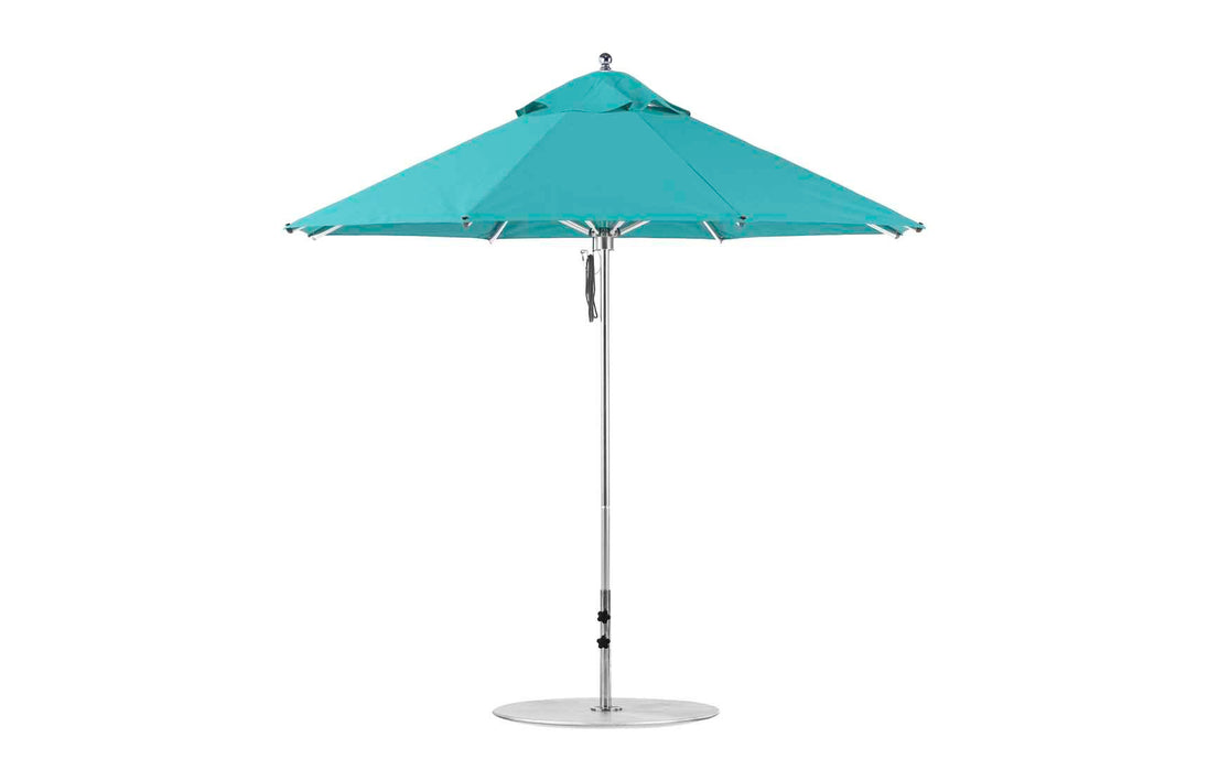 The Ledge Lounger Premier Aluminum Umbrella - 9 Octagon Pulley features a turquoise, wind-resistant canopy with a metal pole. Its vented top provides airflow and shade. Made from marine-grade fabrics, it offers durability and elegance for outdoor spaces.