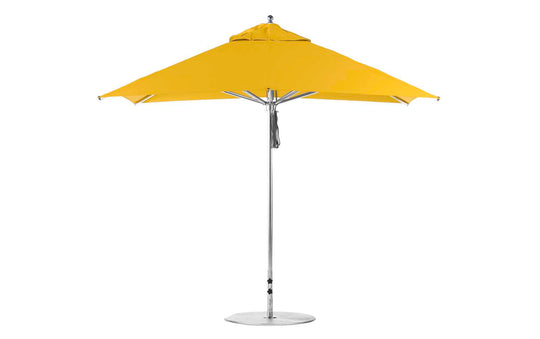 The Premier Aluminum Umbrella – 10 Square Pulley by Ledge Lounger features a yellow canopy with an aluminum pole on a round base, marine-grade fabrics, and a streamlined design that ensures wind resistance, making it ideal for outdoor spaces.