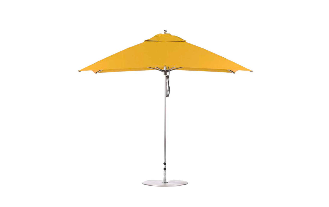 The Essential Fiberglass Umbrella by Ledge Lounger is a 10 square patio umbrella with a metal pole and base. Its simple, modern design includes a wide canopy made from marine-grade fabrics, ideal for outdoor use.