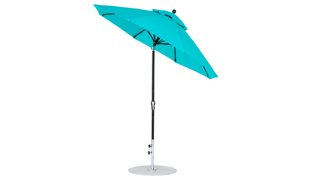 The Ledge Loungers Essential Fiberglass Umbrella, featuring a turquoise canopy and marine-grade fabrics, stands out with its sturdy metal pole and round base. This 7.5 octagon crank auto tilt design is wind-resistant and shown tilted against a plain white background.