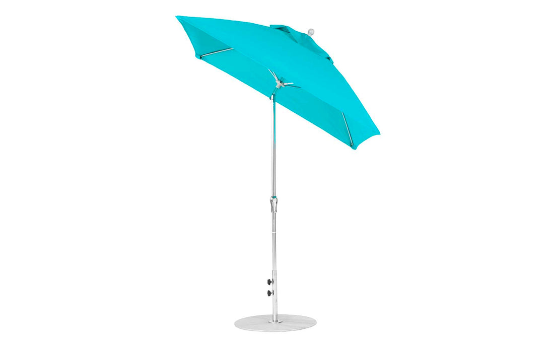 The Ledge Lounger Essential Fiberglass Umbrella - 6.5 features a bright teal canopy, silver pole, and round base. Made from corrosion-resistant materials, it includes a vented top and crank handle for easy adjustment, offering stylish sun protection at the beach or any outdoor space.