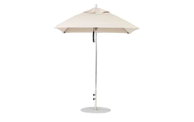 A Ledge Lounger Essential Fiberglass Umbrella - 6.5 Square Pulley in beige stands open on a white background, featuring an aluminum center pole and a round metal base that support its marine-grade fabrics for durable outdoor style.