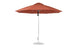 The Essential Fiberglass Umbrella by Ledge Lounger is a large, rust-colored patio umbrella featuring an 11 octagon design with a metal pole and round base. Made with marine-grade fabrics, it offers wind resistance and sleek style, perfect for outdoor use.