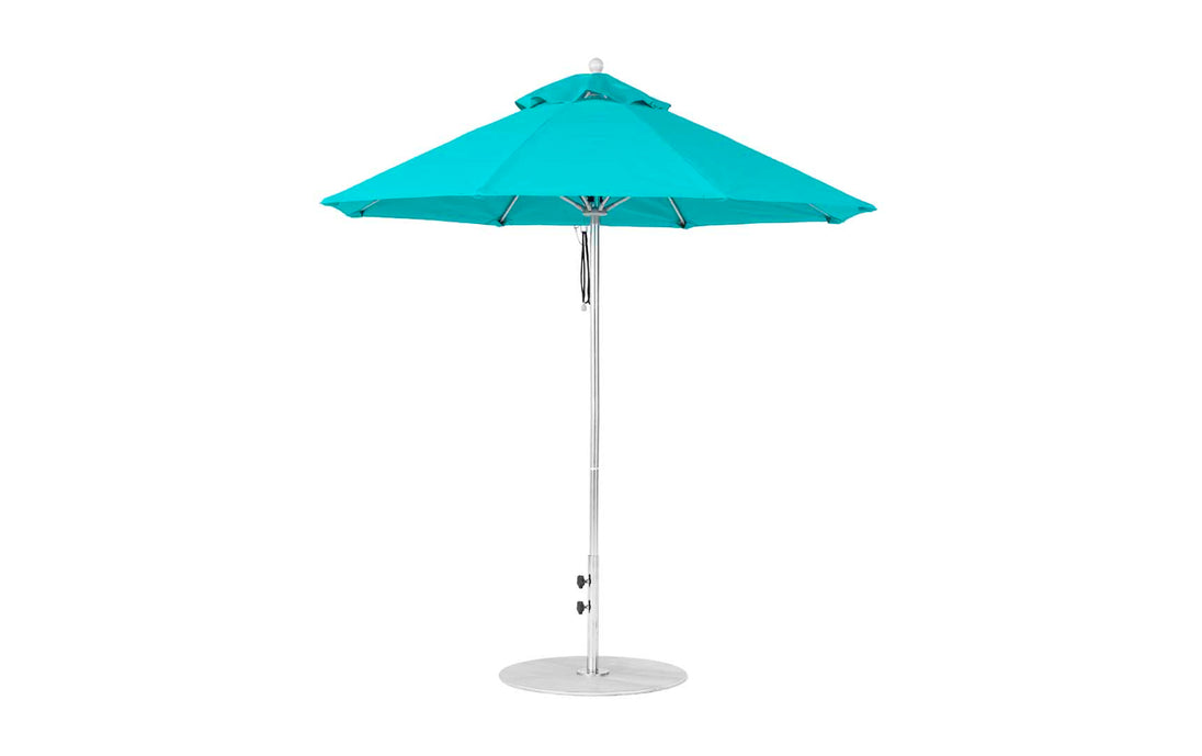 The Essential Fiberglass Umbrella by Ledge Lounger features a turquoise canopy with marine-grade fabric, eight fiberglass panels, and a metal pole on a round base. Its 7.5 octagon pulley design stands open against a plain white background, showcasing its wind-resistant structure.