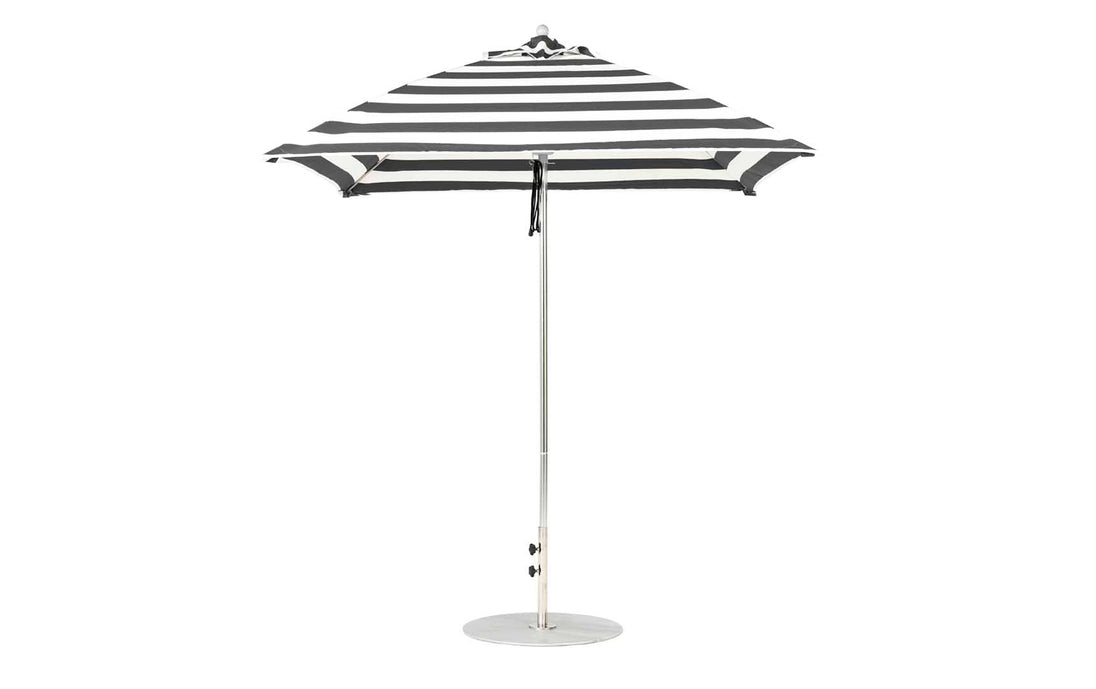 The Essential Fiberglass Umbrella - 7.5 Square Pulley by Ledge Lounger, with black and white stripes, marine-grade fabric, a silver pole, and round base is open against a plain white background.